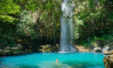 vacancesguadeloupe__beautiful-view-of-a-waterfall-surrounded-by-greene-2026-03-18-09-31-12-utc